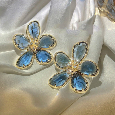 Aretes Rotativos Flor de la Riqueza con Circonitas Incrustadas