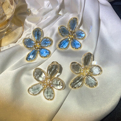 Aretes Rotativos Flor de la Riqueza con Circonitas Incrustadas