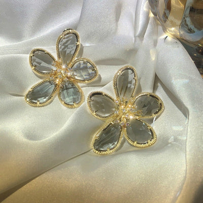 Aretes Rotativos Flor de la Riqueza con Circonitas Incrustadas